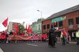 Thousands of people – including Batman – attend Irish language rally march in Belfast