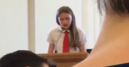WATCH: Girl comes out as gay in front of church and has mic cut off during speech