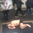 Semi-naked men are laying down in the street to promote men’s mental health awareness