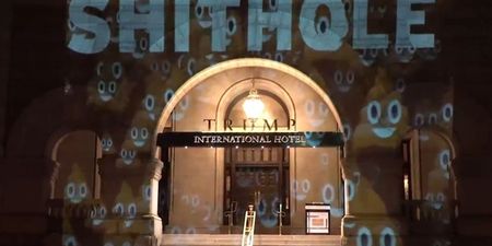 The word ‘Shithole’ is being projected on to the front of Donald Trump’s hotel in Washington