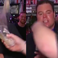 TV reporter gets beer thrown in his face during a very volatile report on the England match