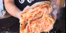 WATCH: Do you think you could take down this giant pizza-burrito?