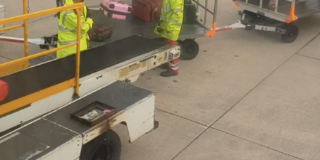 WATCH: Manchester Airport release statement after baggage handlers toss luggage without a care in the world