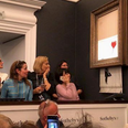 Banksy painting sold for $1.1 million at auction, immediately self-destructs