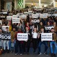 A number of DCU students protest the potential deportation of a student outside the Department of Justice