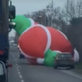 WATCH: Gigantic inflatable Santa goes rogue and holds up traffic