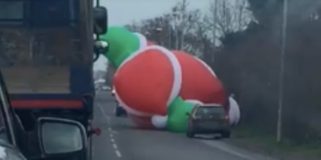 WATCH: Gigantic inflatable Santa goes rogue and holds up traffic