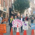 Environmental protestors block cars from driving on busy Dublin street