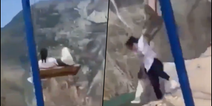 Two women escape with minor injuries after terrifying fall from swing on 6,300ft cliff edge in Russia