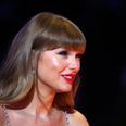Taylor Swift poses for pictures with fans during Belfast trip