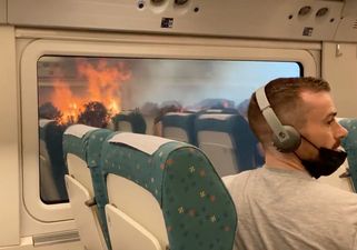 Apocalyptic scenes as train grinds to a halt in the middle of blazing wildfires