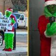 Grinch stands outside primary school with ‘Santa is fake’ sign